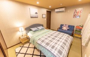 מיטה או מיטות בחדר ב-Guest House Kubo Homes Tengachaya 1