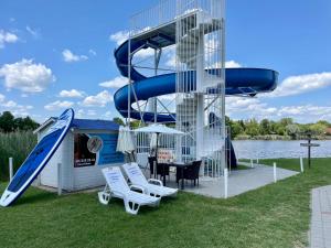 a slide on a water park with a water slide at VILLA BARRACA in Dunapataj