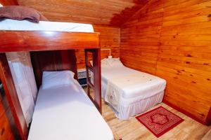 Postel nebo postele na pokoji v ubytování Cabin Renty Beach
