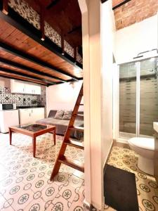 a room with a loft bed and a bathroom at P3 Estudio con cocina!Balcón privado! 2`del metro P3 in Barcelona