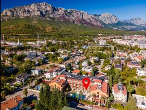 una vista aérea de una ciudad con montañas en el fondo en ASTORIA PARK Hotel & Spa ALL INCLUSIVE en Antalya