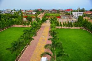 an aerial view of a park with palm trees at lake palace beach hotel in Bujumbura