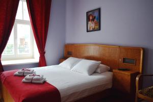 Posteľ alebo postele v izbe v ubytovaní Chopin Boutique