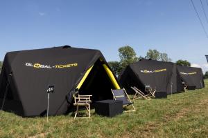 a group of tents sitting in the grass at TT Camping Jan & Bertha - by Global-Tickets in Assen