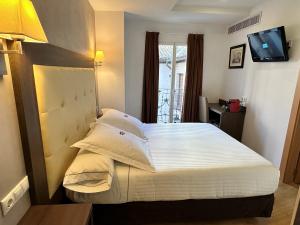 Postel nebo postele na pokoji v ubytování Antídoto Rooms Zocodover Check-in on line