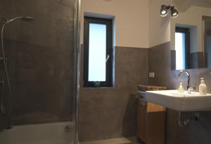 a bathroom with a shower and a sink at Ferienwohnung Vogelnest in Prien am Chiemsee