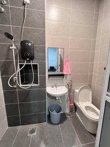 a bathroom with a shower and a toilet and a sink at [New Double Storey] 12 to 14 Pax - SG ABONG - BRIGHT INN HOMESTAY in Muar