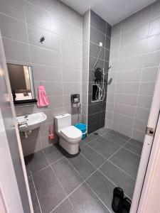 a bathroom with a toilet and a sink at [New Double Storey] 12 to 14 Pax - SG ABONG - BRIGHT INN HOMESTAY in Muar
