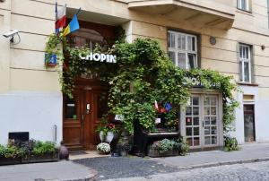 a building with a sign on the front of it at Chopin Boutique in Warsaw