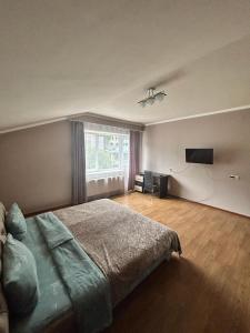 Letto o letti in una camera di Комнаты у Айрин