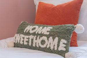 a pillow with the words pub welcome on a bed at Rest & Recharge at Mapledon House (15mins to City Centre) in Manchester