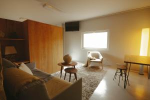 a living room with a couch and a table at Hotel Garaiko Landetxea in Durango