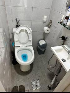 a small bathroom with a toilet and a sink at How are you here in Hongdae in Seoul