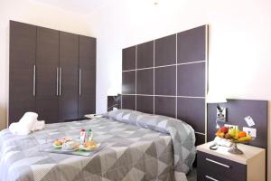 Giường trong phòng chung tại Hotel Vitruvio