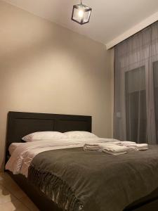 Postel nebo postele na pokoji v ubytování R&K MODERN APARTMENT