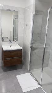 a bathroom with a shower and a sink at CAZAM Paris Saint Ouen in Saint-Ouen