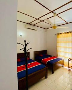 Letto o letti in una camera di Punchi Walawwa - Guest House - Holiday Bungalow