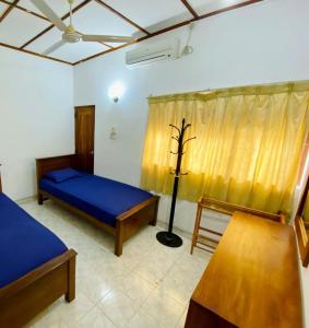 Letto o letti in una camera di Punchi Walawwa - Guest House - Holiday Bungalow
