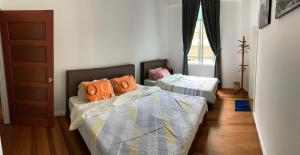 Ένα ή περισσότερα κρεβάτια σε δωμάτιο στο HappyHomestay +2 φωτογραφίες
