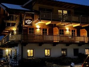 a building with a sign on the side of it at Stegerhof in Santa Maddalena