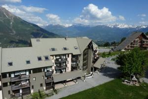 an aerial view of a building with mountains in the background at Boost Your Immo Aurans Réallon 666A in Réallon