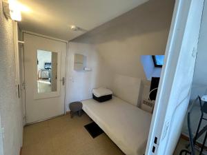 a small room with a bed and a mirror at Boost Your Immo Aurans Réallon 666A in Réallon