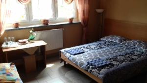 Łóżko lub łóżka w pokoju w obiekcie Uslugi Hotelowe Władysław