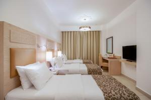 Posteľ alebo postele v izbe v ubytovaní Toledo Amman Hotel