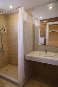 a bathroom with a sink and a shower at Sayadeen Village - Red Sea Riviera in Nuweiba