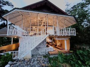 a house with a staircase leading up to it at Wabi Sabi House Broga in Semenyih