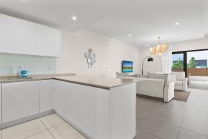 a kitchen and living room with white walls at Stunning Apt in Mijas by Costarentals - Ref 235 in Mijas Costa