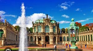 a large building with a fountain in front of it at Apartment City Center Prestige in Dresden