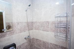 a bathroom with a shower with a glass door at Trendy Studios with FREE PARKING in Veliko Turnovo in Veliko Tŭrnovo