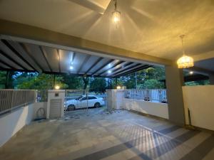 a covered patio with a car parked in a parking lot at DD Homestay Pasir Gudang in Pasir Gudang