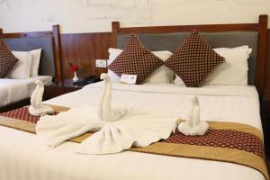 Voodi või voodid majutusasutuse Hotel Jungle Crown toas