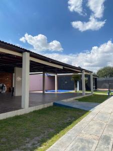 a view of a building with a parking lot at Quinta del Eden, 9PX, Pool, BBQ, Pet Friendly in Matehuala