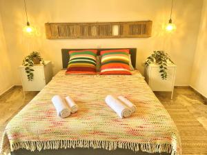 A bed or beds in a room at The Beachhouse Apartments