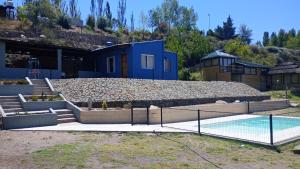 a house with a pool and a tennis court at Mendoza, Cacheuta, montaña in Ciudad Lujan de Cuyo