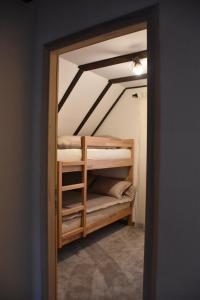 a closet with bunk beds in a room at Villa Šola in Kupres