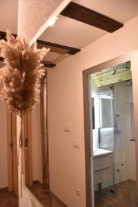 a bathroom with a glass door leading to a shower at Villa Šola in Kupres