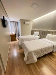 Кровать или кровати в номере Ouro Cerrado Palace Hotel