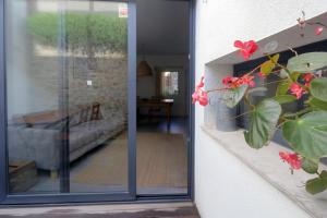 a sliding glass door leading into a living room at Casa moderna y confortable en el corazón del Empordà in Colomés