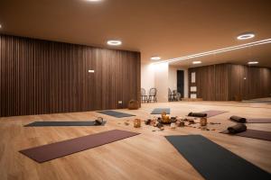 a room with a lot of yoga mats on the floor at Chalet Goyen in Schenna