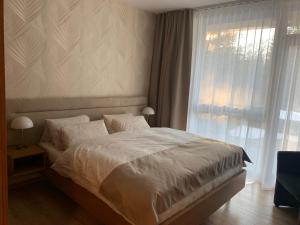 Postel nebo postele na pokoji v ubytování Comfort Apartments with parking - Tale