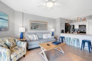 a living room with a couch and a table at Tropical Getaway w/Private Beach 1 BD Condo in Tavernier