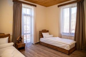 Postel nebo postele na pokoji v ubytování Jean Chardin Dilijan