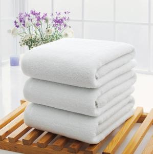 four towels stacked on a wooden tray in a bathroom at Cozy apartment with 5 bedrooms, whole apartment, апартмент целиком in Dilijan