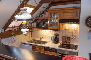 a kitchen with a sink and a counter top at Ferienhaus Geißler Meran in Molberting