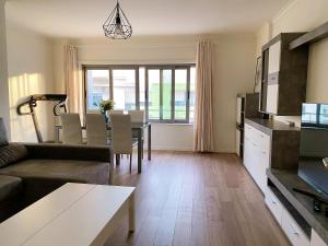 a living room with a couch and a table at Always on the way - Road Home in Montijo, Lisbon in Montijo