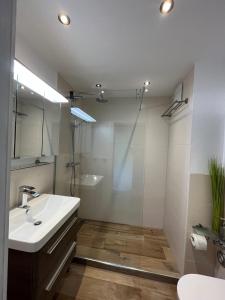 a bathroom with a sink and a shower at Ferienwohnung Spreng in Reit im Winkl